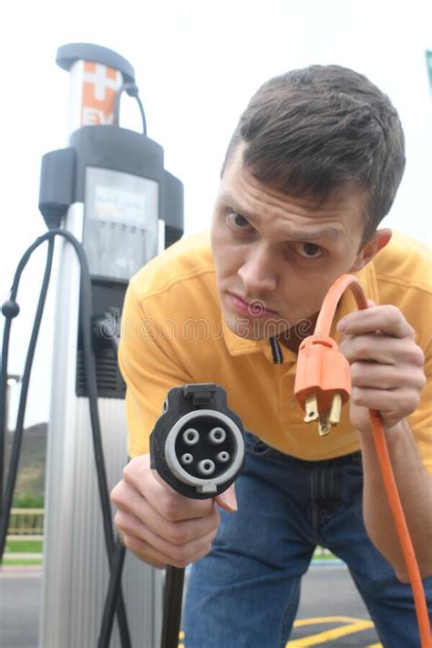 Man Charging His Electric Vehicle Stock Image Image Of Volts Vehicle