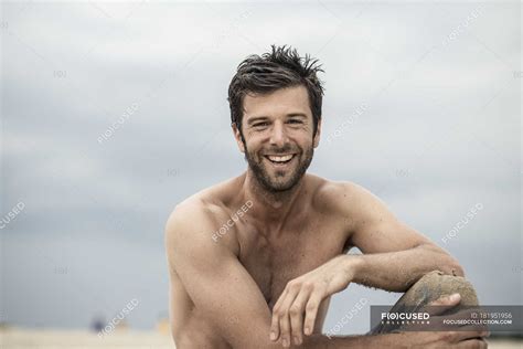 Portrait Of Topless Laughing Man Smiling At Camera Male Tranquility Stock Photo