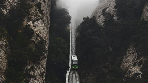 Download Wallpaper 2560x1440 Railway Fog Train Mountains Aerial