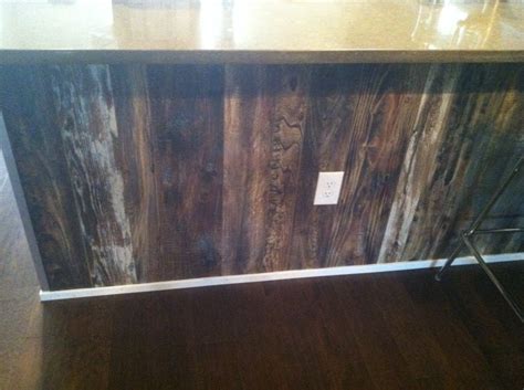 Stereo cabinet make from reclaimed barn wood and glass found on site. Breakfast bar trimmed in reclaimed wood look laminate by ...