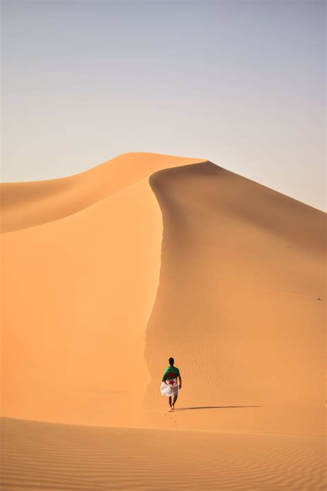 Man Walking On Desert · Free Stock Photo