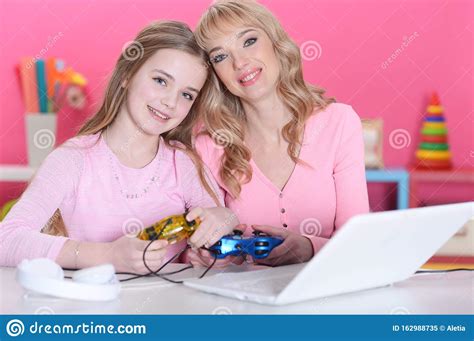 Close Up Portrait Of Happy Mother And Daughter Playing Game Stock Image