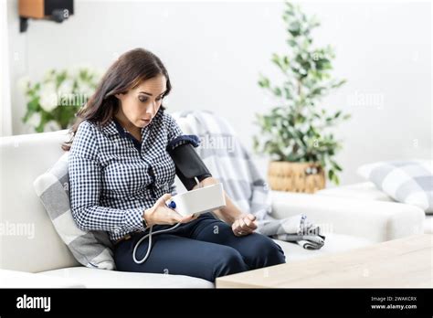 Shocked Woman After Measuring Blood Pressure With A Measuring Device