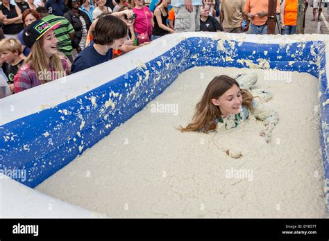 St George South Carolina Usa 12th Apr 2014 A Girl Rolls In A Vat Of Grits During The World