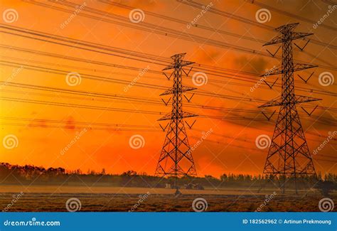 High Voltage Electric Pylon And Electrical Wire With Sunset Sky