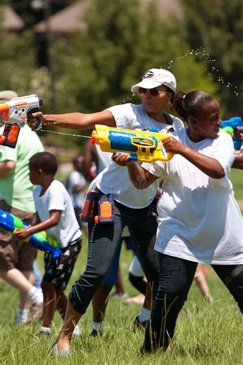 Women Squirt Opponents In Group Water Gun Fight Editorial Stock Photo
