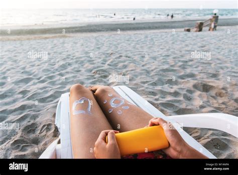 Woman Using Sun Lotion On Beach Summer Vacation Stock Photo Alamy