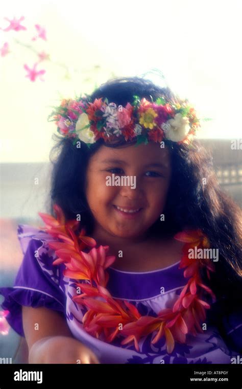 Beautiful Smiling Young Hawaiian Girl Dressed In Purple Muu Muu And Wearing Haku Lei Floral