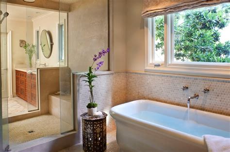 For instance, this large, uninterrupted window, brings the surrounding environment into one's experience. Zen Bathrooms - Eclectic - bathroom - Natasha Baradaran