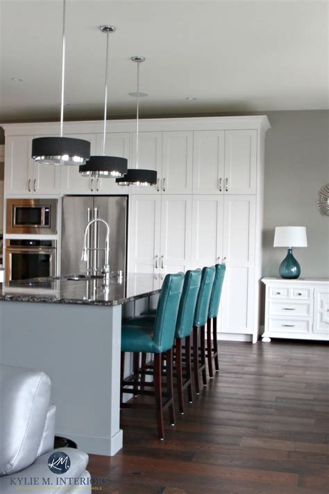 Gallery featuring images of 34 kitchens with dark wood floors. Contemporary white kitchen with gray painted island in ...