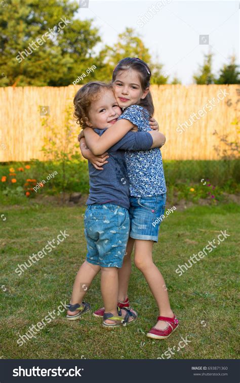 Happy Little Kids Hugging Each Other Stock Photo 693871360 Shutterstock