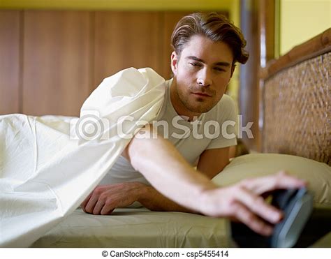 Young Adult Man Waking Up In The Morning Caucasian Adult Man In Bed