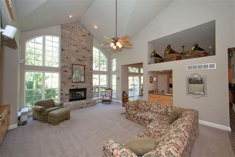 2 Story Great Room With Floor To Ceiling Brick Fireplace And Wet Bar