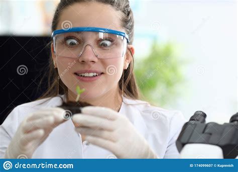 girl laboratory assistant admires sprout earth stock image image of life agronomist 174099607