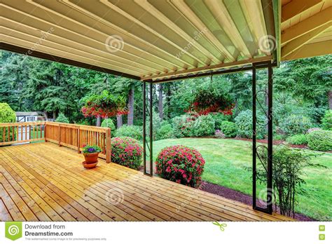 Wooden Walkout Deck Well Kept Garden With Bushes And Flowers Stock