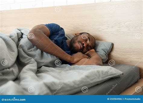 Black Man Sleeping Covered With Blanket Resting In Bedroom Indoor Stock