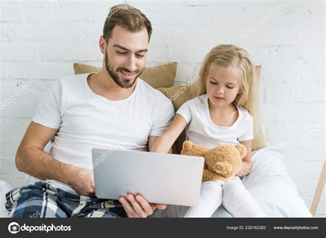 Happy Father Cute Little Daughter Teddy Bear Using Laptop Together