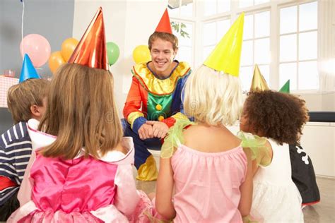 Clown Entertaining Children At Party Stock Image Image Of Enjoying