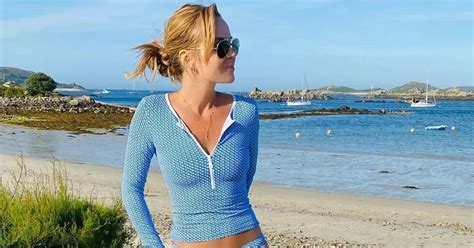 Amanda Holden Stuns In Quirky Blue Bikini For British Coastal