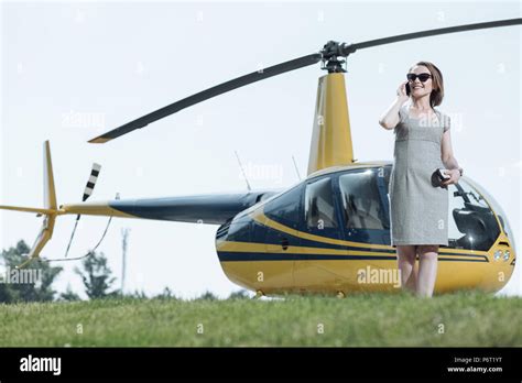 Beautiful Young Woman Calling Helicopter Pilot Stock Photo Alamy