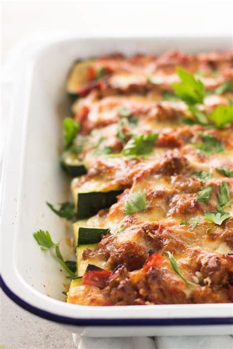 In this stuffed zucchini recipe, turkey sausage and tomato are mixed with quinoa before filling the zucchini boats. Italian Sausage Stuffed Zucchini Boats Image - Food Fanatic