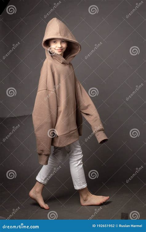 Child Girl With Long Hair Gathered In A Bun Stock Photo Image Of