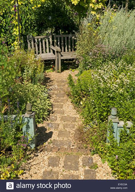 Small English Cottage Garden With Paved And Gravel Path
