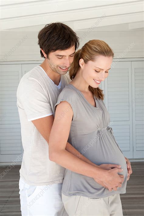 Man Holding Pregnant Girlfriends Belly Stock Image F005 3081 Science Photo Library