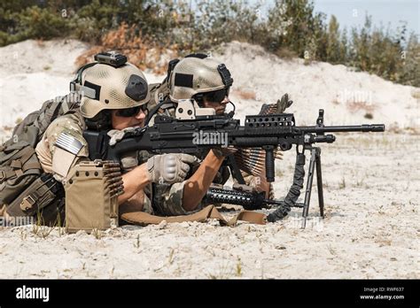 Members Of Us Army Rangers Machine Gun Crew During A Fight In The