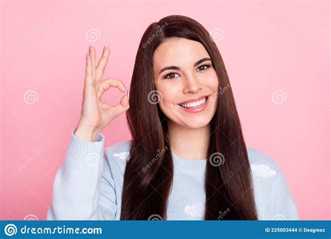 Photo Of Pretty Adorable Young Lady Dressed Blue Sweater Smiling Showing Okey Sign Isolated Pink
