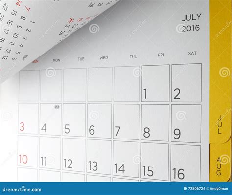 Close Up Cardboard Desk Calendar With Days And Dates Of July 2016 In