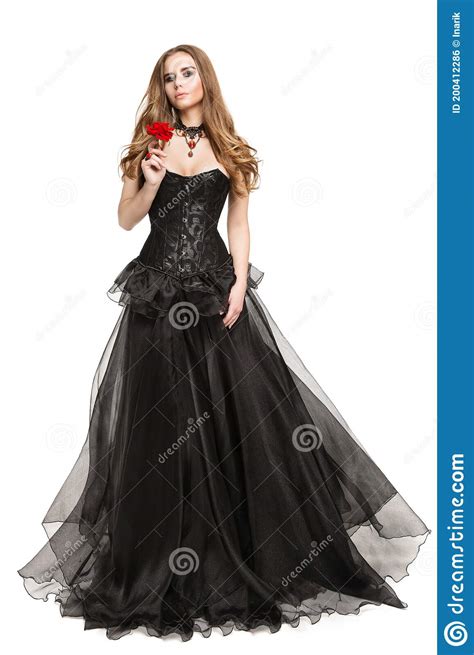 Fashion Model In Black Corset Vintage Dress Smelling Red Rose Flower