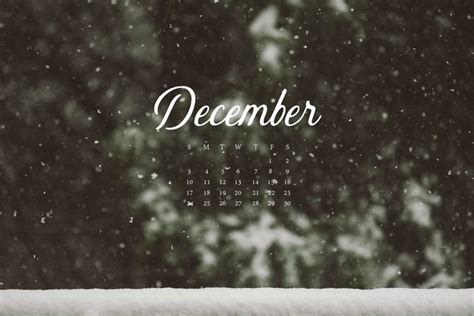 A Calendar With The Word December Written On It And Snow Falling Down