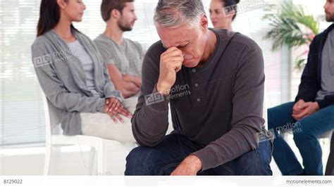 Man Comforting Another In Rehab Group At Therapy Stock Video Footage