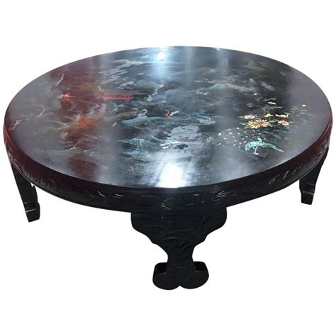 I lightly sanded the living room coffee table so that the paint would stick better, and then applied two coats of the chalk paint mixture. Hand-Painted Asian Black Lacquer Coffee Table | Chairish