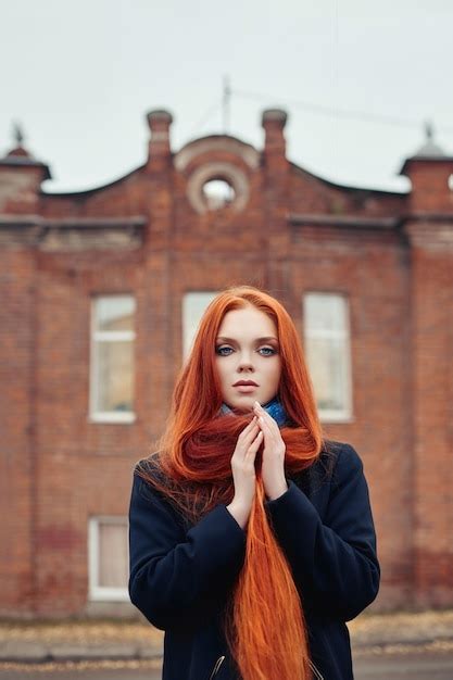 Premium Photo Woman Long Red Hair Walks In Autumn On The Street