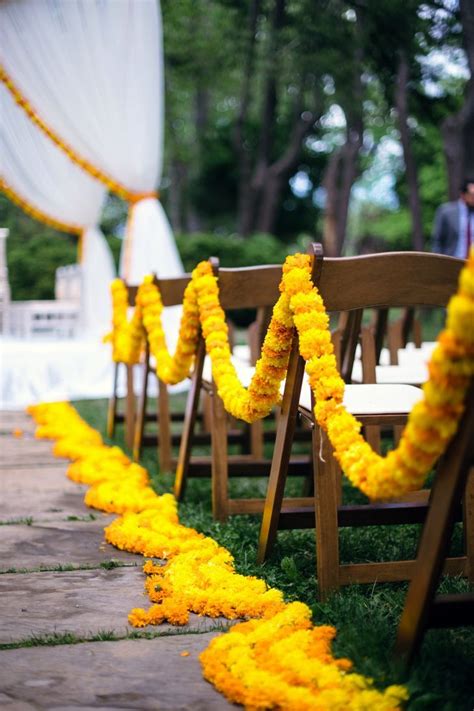 Aisle Accented With Orange And Yellow Marigolds For A Beautiful Outdoor