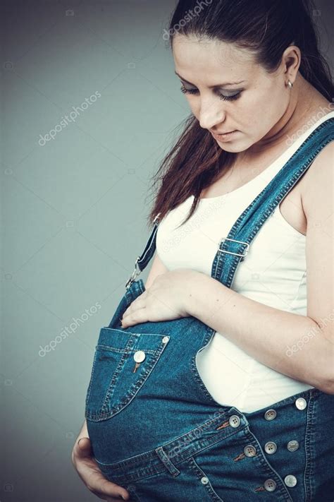 Pregnant Girl In Denim Overalls Stock Photo Ewastudio