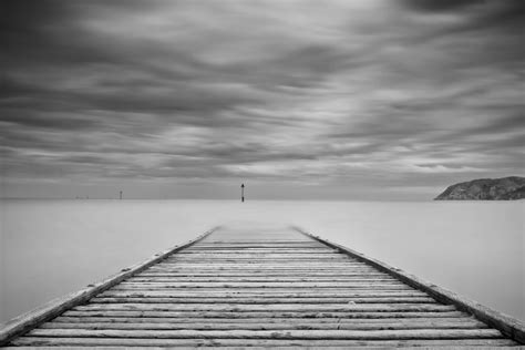Grayscale Photography Of Wooden Dock Sea Grayscale Photography