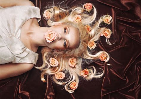 Sensual Tender Woman Portrait With Unusual Magical Gaze And Peachy Roses In Hair Stock Image
