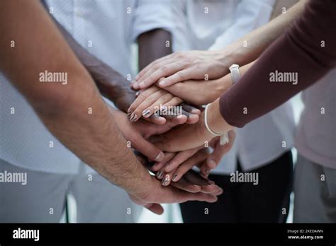 Business People Joining Hands In The Office Concept Of Teamwork And Partnership Double