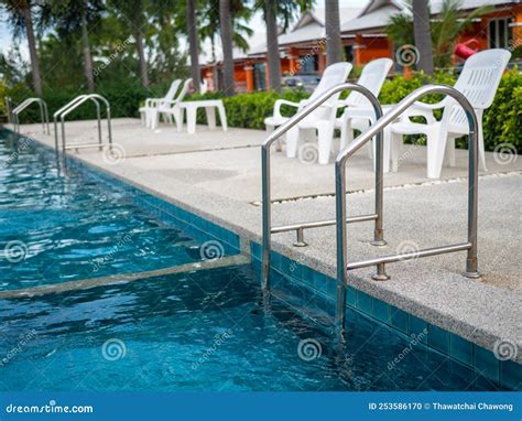 Stainless Steel Stairs To The Pool Handrails Up And Down The Pool