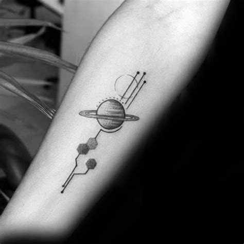 A Black And White Photo Of A Tattoo On The Arm