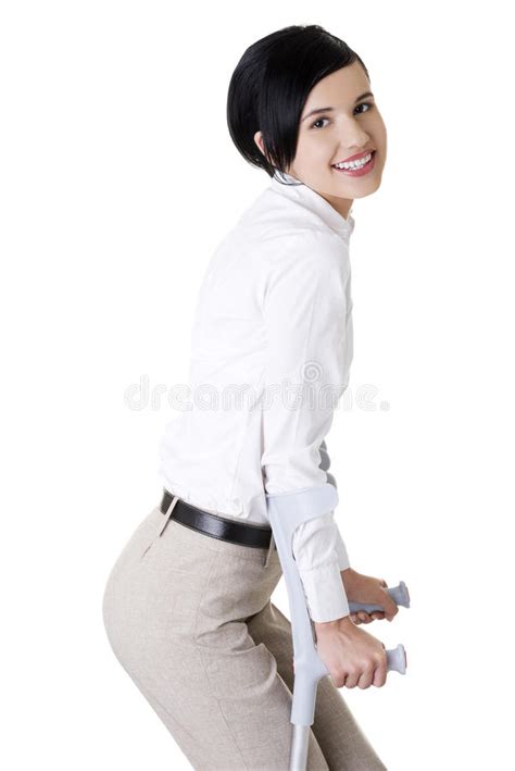 Happy Young Businesswoman With Crutches Stock Photo Image Of Brunette