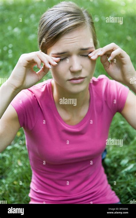 Woman Rubbing Eyes Stock Photo Alamy