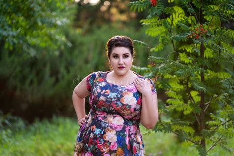 Plus Size Fashion Model In Floral Dress Outdoors Beautiful Fat Woman