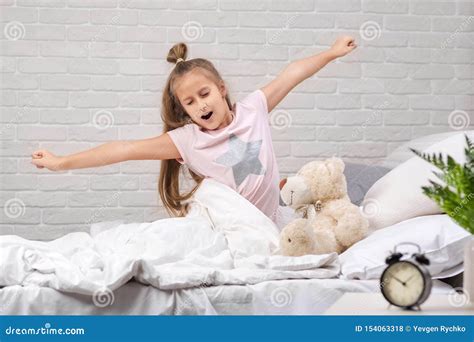 Little Child Girl Wakes Up From Sleep Stock Photo Image Of Child