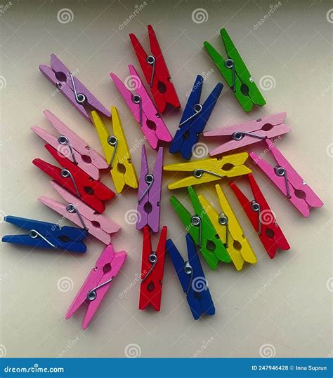 Multi Colored Small Clothespins On A White Background Close Up Stock