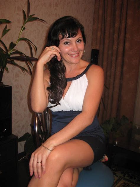 Vkdamochki Beautifully Smiling Brunette At Home With Her Legs Crossed