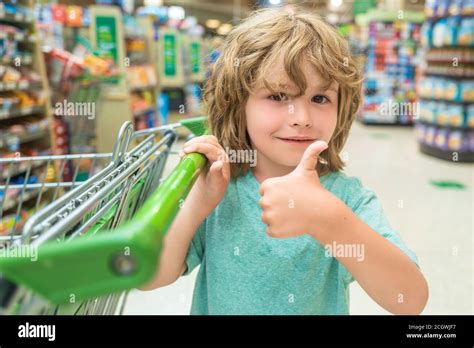 Portrait Of Child In Grocery Shopping In Supermarket Boy With A